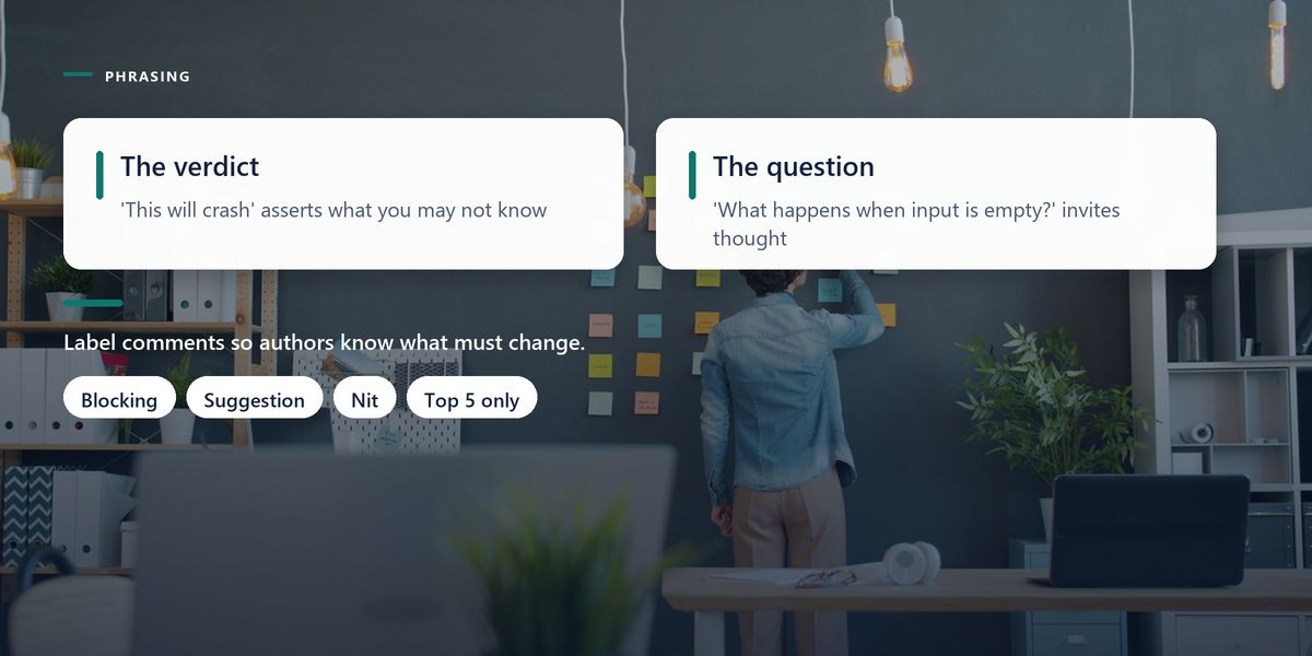 A person arranges sticky notes on a dark wall, darkened further behind two panels contrasting verdict comments with question comments.