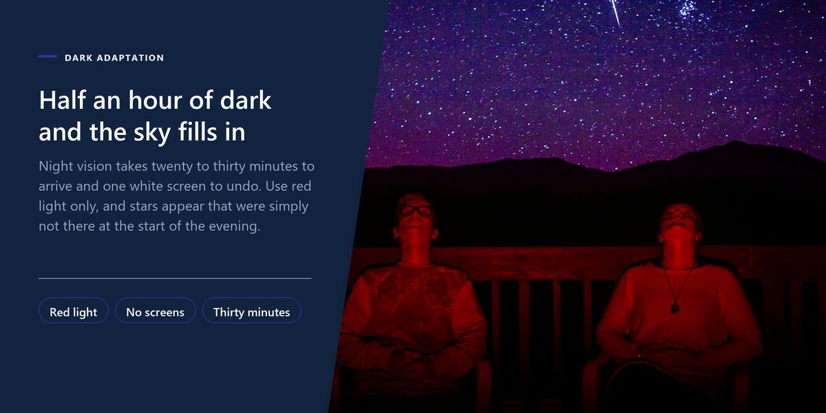 Two people sitting on a deck under a starry sky lit only by red light, beside a banner on dark adaptation and what destroys it.